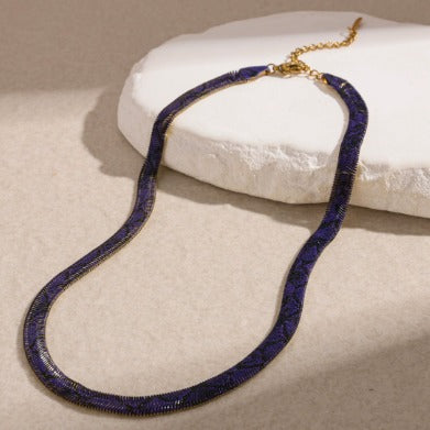 Supplier photograph of the purple flat python mesh necklace, showing the clasp and extender.